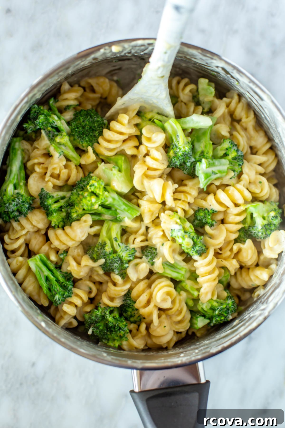 Creamy One-Pot Broccoli Alfredo Pasta 9 A close-up shot of the rich, creamy one-pot broccoli alfredo pasta simmering in a large pot, ready for the final touches.