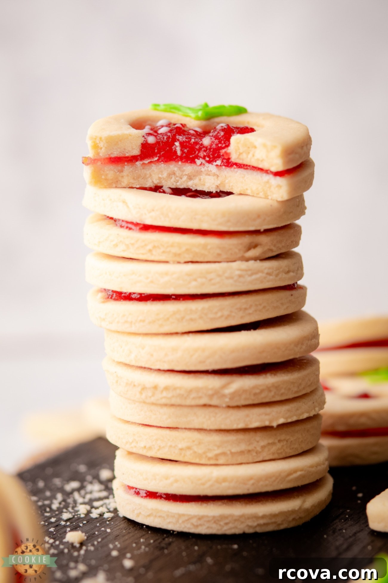 Fruit-Kissed Linzer Cookies 9 A stack of delicious fruit-shaped Linzer cookies with jam filling
