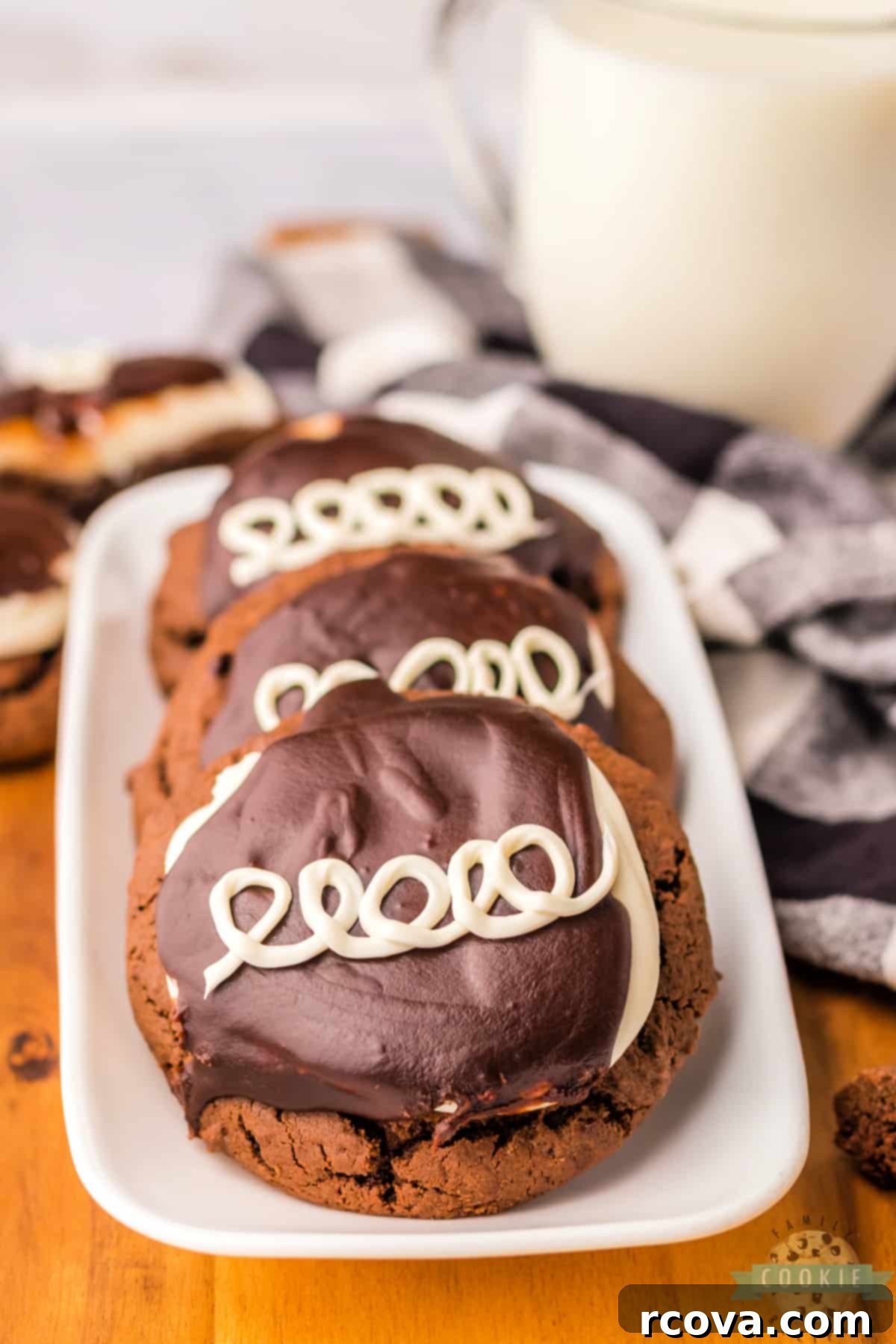 Copycat Hostess Cupcake Cookies 13 Close-up of frosted chocolate cookies with marshmallow buttercream and chocolate ganache