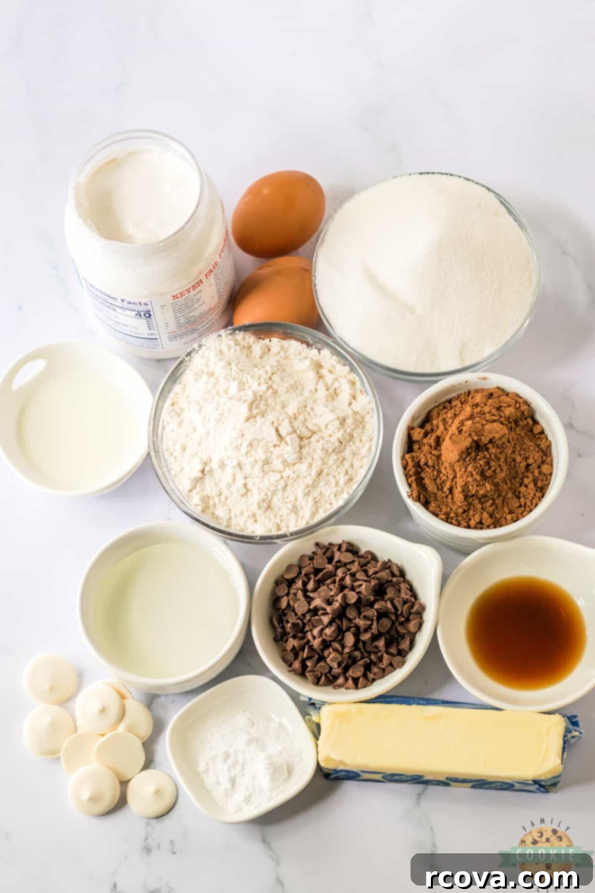 Copycat Hostess Cupcake Cookies 5 Array of ingredients for Hostess Cupcake Cookies, including butter, sugar, flour, cocoa, eggs, marshmallow fluff, chocolate chips, and more