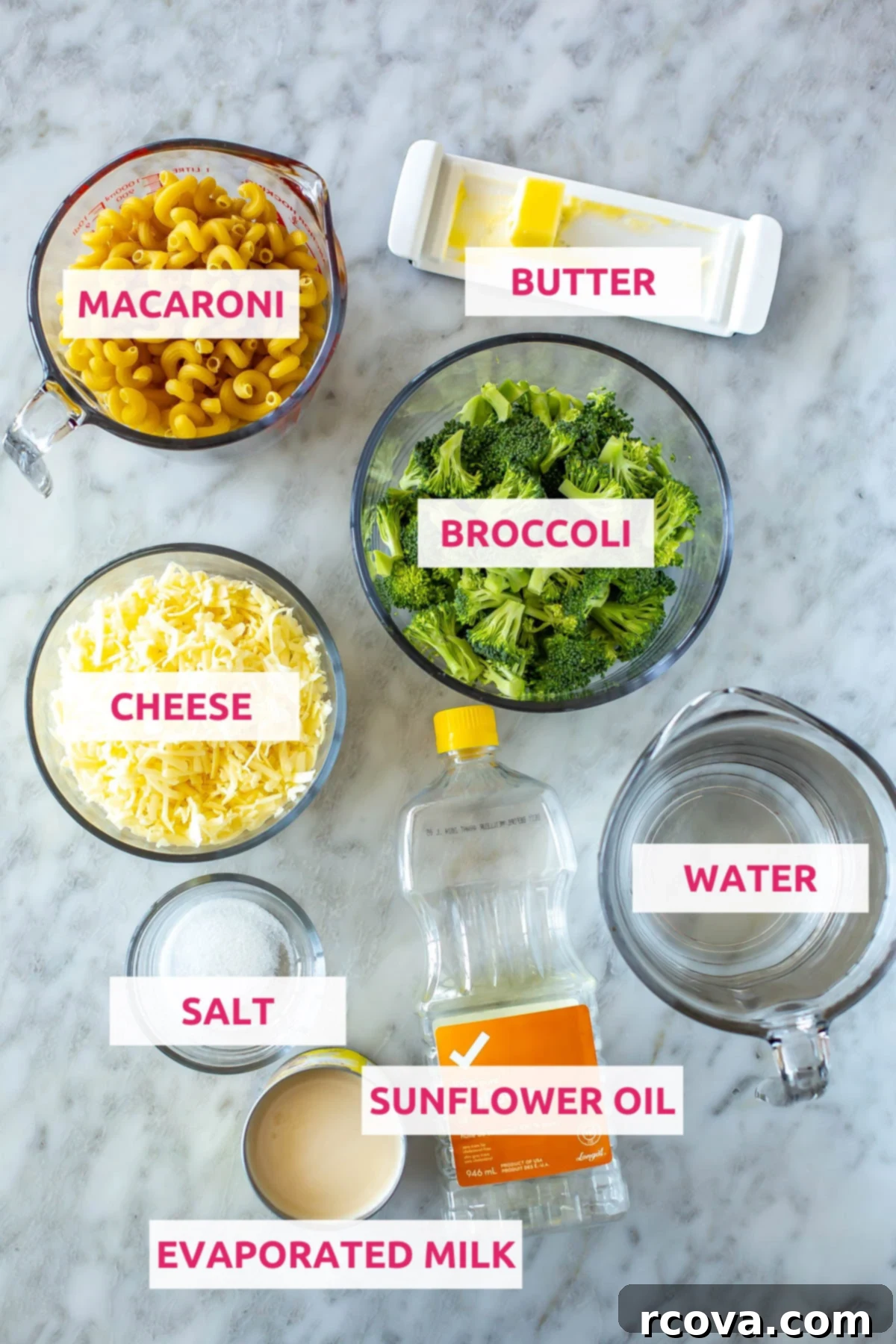 Wholesome Broccoli Mac and Cheese 4 A flat lay image showing all the ingredients required for Instant Pot Healthy Mac and Cheese: macaroni, white cheddar cheese, butter, broccoli, water, salt, evaporated milk, and sunflower oil.