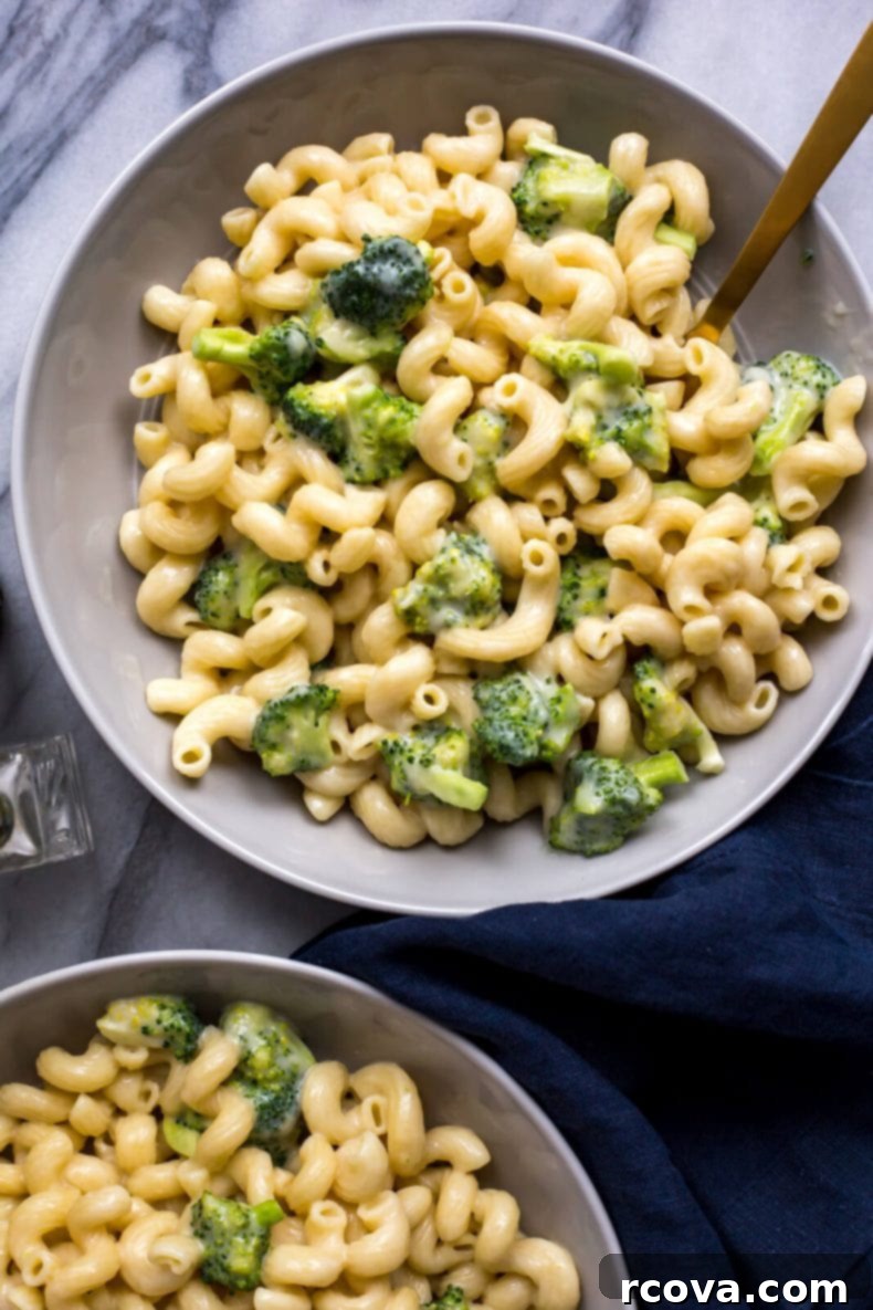 Wholesome Broccoli Mac and Cheese 7 A close-up shot of Healthy Instant Pot Mac and Cheese with broccoli, garnished with fresh herbs.