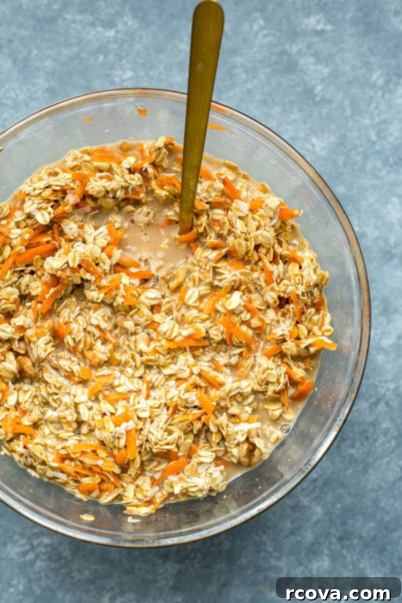 Wholesome Carrot Cake Oatmeal Cups 6 batter in a bowl to make carrot muffins