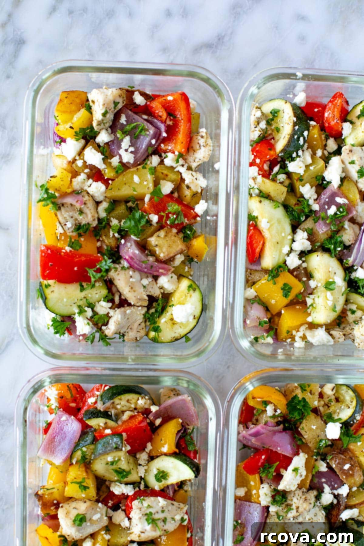 Mediterranean Sheet Pan Chicken: Ready-to-Go Meals 7 Sheet pan Greek chicken in glass meal prep bowls, ready for storage