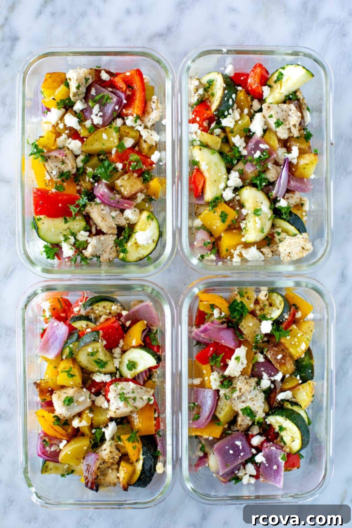 Mediterranean Sheet Pan Chicken: Ready-to-Go Meals 9 Sheet pan Greek chicken carefully portioned into glass meal prep bowls