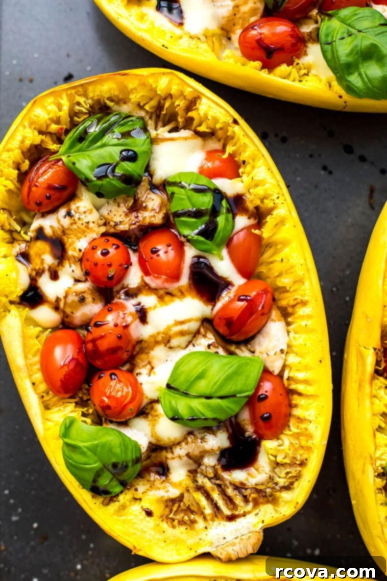 Caprese Chicken Stuffed Spaghetti Squash 8 Close-up of Chicken Caprese Spaghetti Squash Boats with basil and glaze
