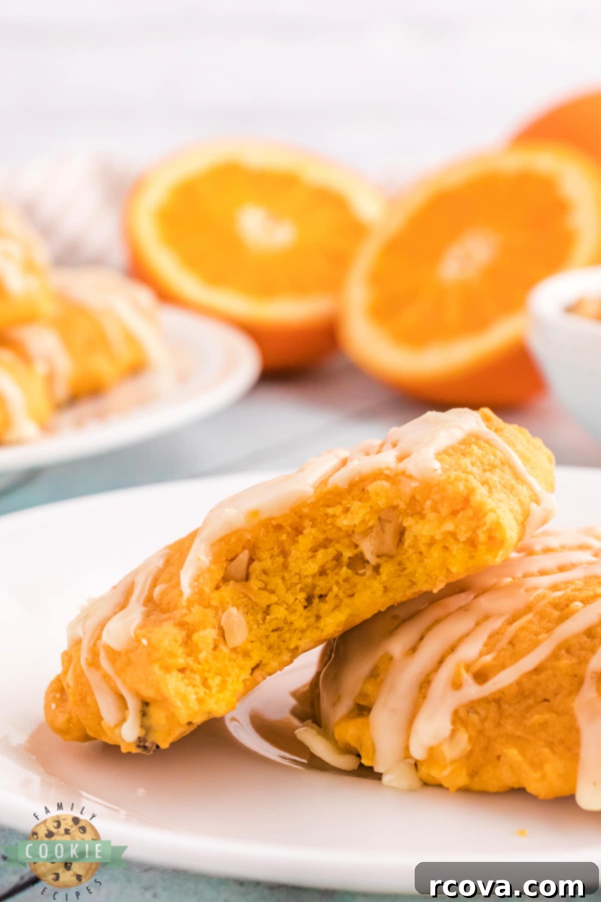Golden Pumpkin Cookies 14 Close-up of baked pumpkin cookies with vibrant orange glaze, highlighting the texture and color.