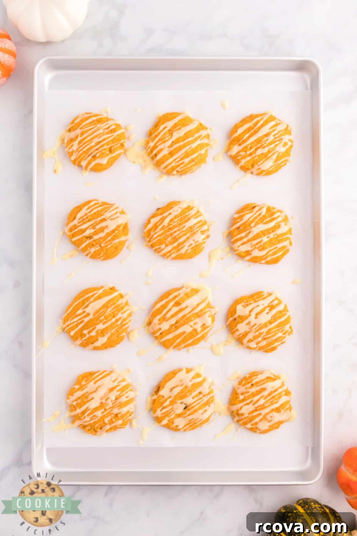 Golden Pumpkin Cookies 15 Close-up of a perfectly baked Orange Pumpkin Cookie with glaze, ready to be enjoyed as a fall treat.
