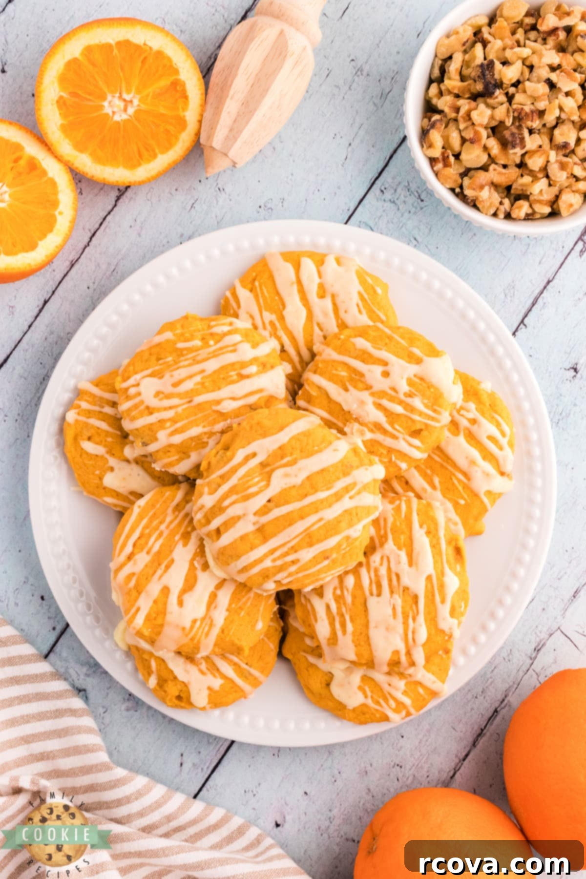 Golden Pumpkin Cookies 5 A plate of freshly baked Pumpkin Orange Cookies drizzled with a sweet citrus glaze.