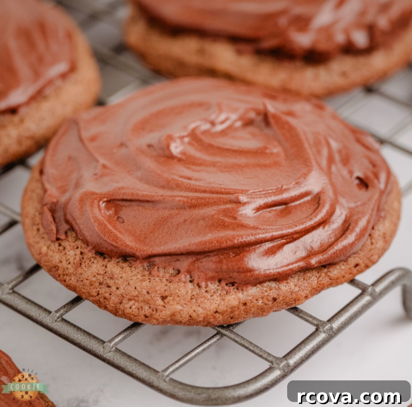 Midnight Chocolate Bliss Cookies 6 frosted chocolate cookie on a cooling rack