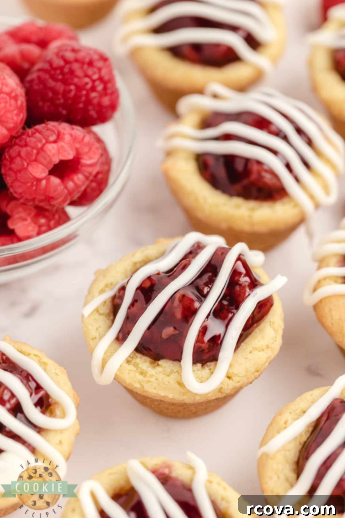 Zesty Berry Cookie Bites 6 Lemon cookie cup with raspberry pie filling and white chocolate drizzle