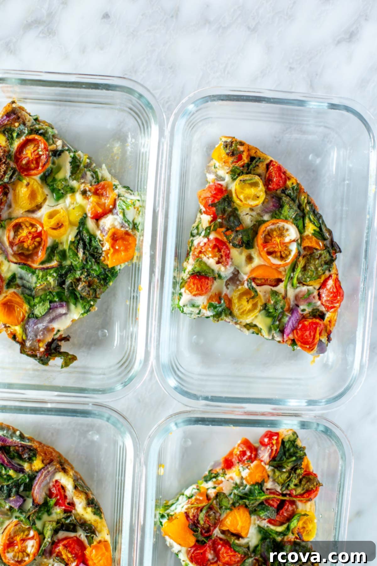 Quick 5-Ingredient Egg White Frittata Meal Prep 8 A close-up of egg white frittata slices neatly placed in glass meal prep containers.