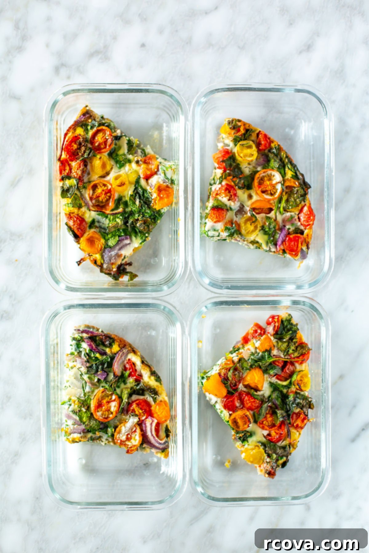 Quick 5-Ingredient Egg White Frittata Meal Prep 9 Four glass containers, each with a piece of egg white frittata, perfectly portioned for the week.