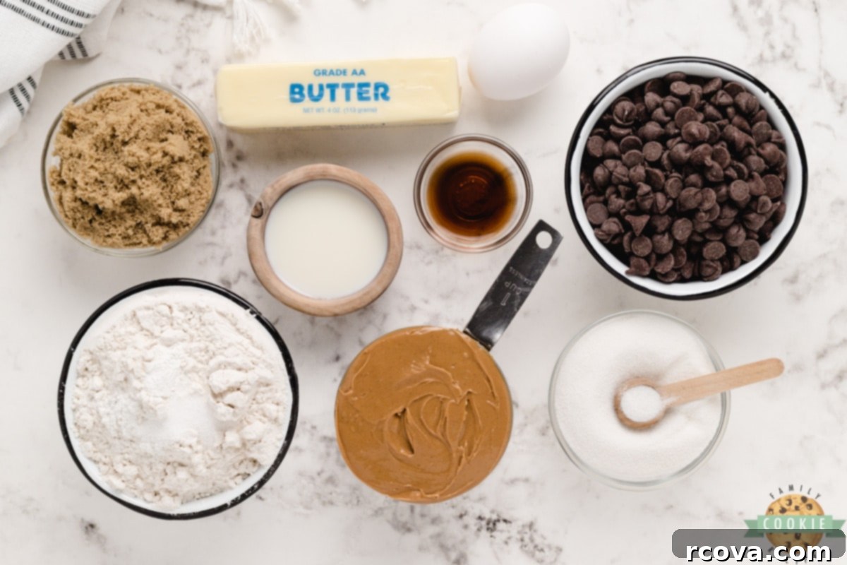 Decadent Peanut Butter Chocolate Chip Delights 6 Key ingredients laid out for making Peanut Butter Chocolate Chip Cookies: peanut butter, butter, sugars, egg, flour, chocolate chips