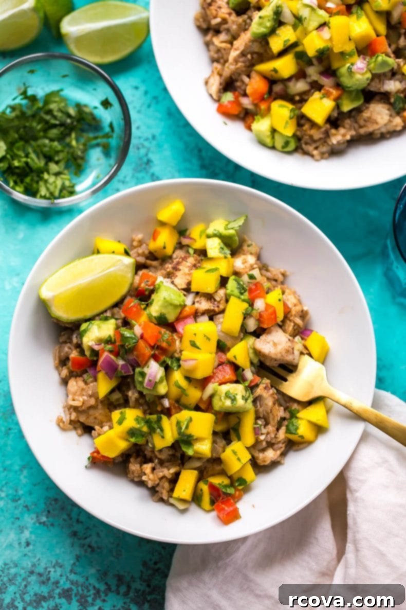 Instant Pot Caribbean Chicken 2 Instant Pot Caribbean Jerk Chicken with fresh mango salsa, showing a vibrant, healthy meal ready to be served