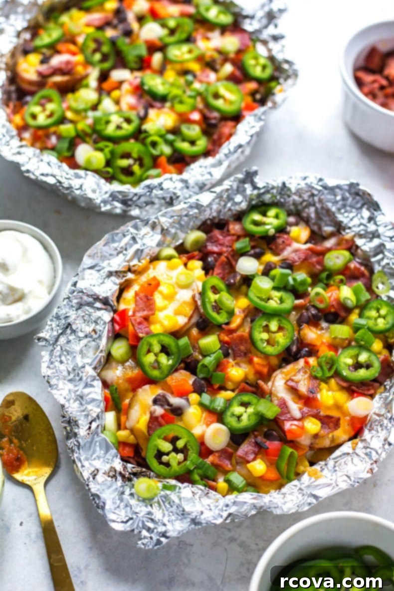 Grilled Cheesy Potato Nacho Packets 5 Delicious seasoned potato slices arranged in foil packets, ready for the grill, showing the simple preparation for cheesy potato nachos.