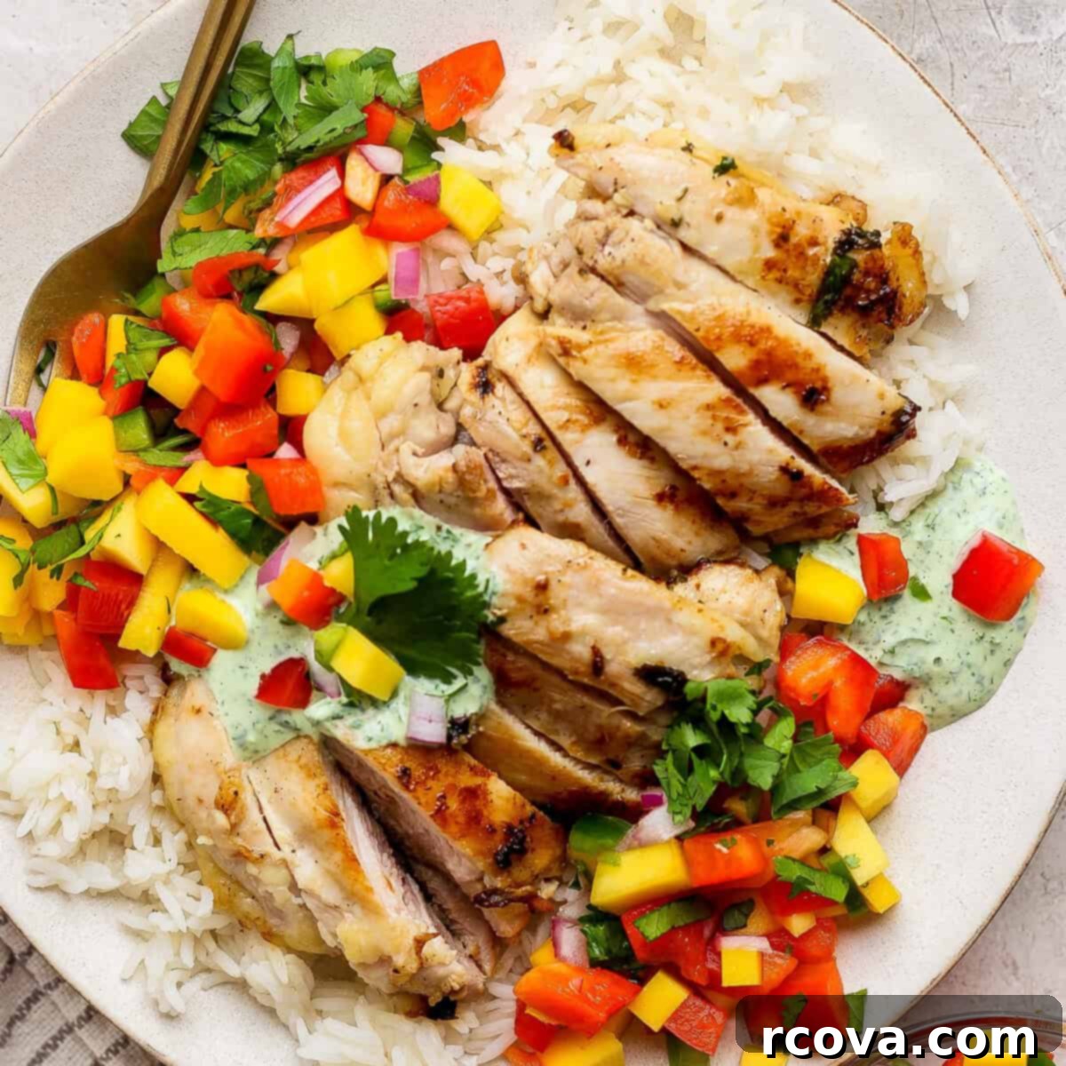 40+ Easy and Healthy Meal Prep Lunches for Work 42 Cilantro Lime Chicken with Mango Salsa via Fit Foodie Finds, a low-carb, high-protein meal.