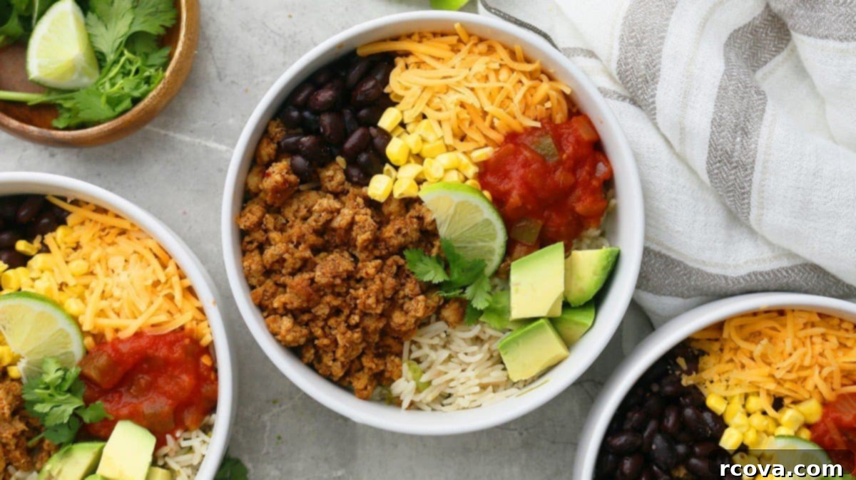 40+ Easy and Healthy Meal Prep Lunches for Work 43 Chicken Rice Bowl via Kitchen At Hoskins with seasoned ground Mexican chicken, cilantro lime rice, and black beans.