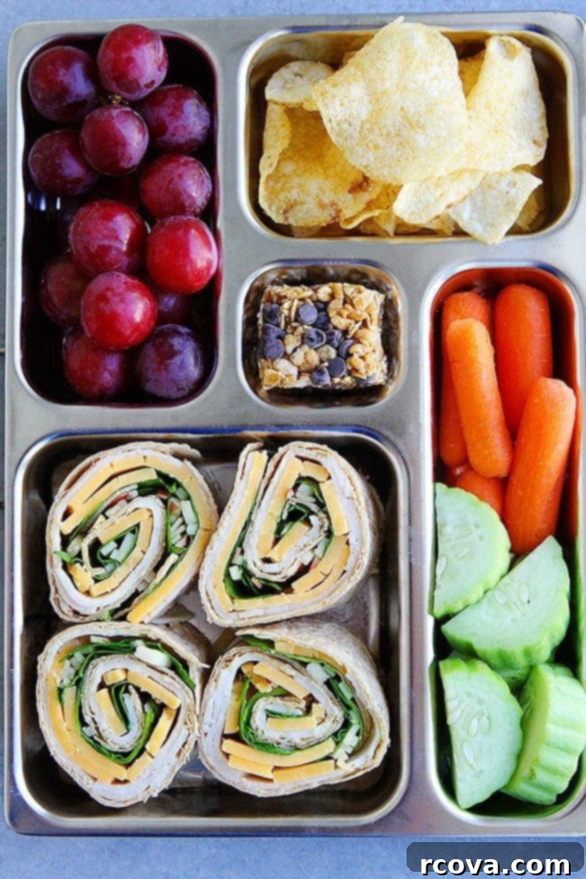 40+ Easy and Healthy Meal Prep Lunches for Work 7 Turkey Cheddar Apple Pinwheels via Two Peas and Their Pod, an easy and fun lunch idea.