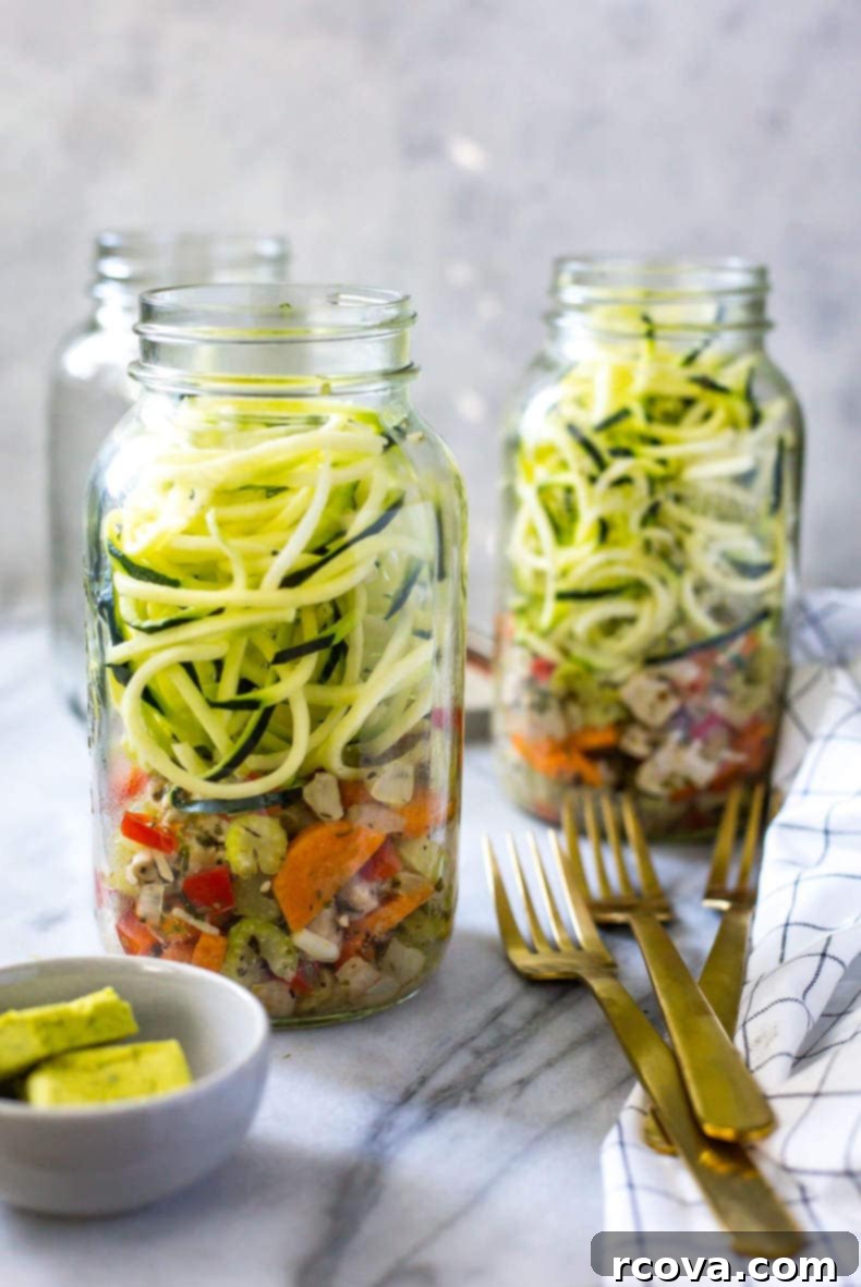 40+ Easy and Healthy Meal Prep Lunches for Work 8 Spiralized Zucchini Chicken Noodle Soup Jars, a healthy meal prep idea.