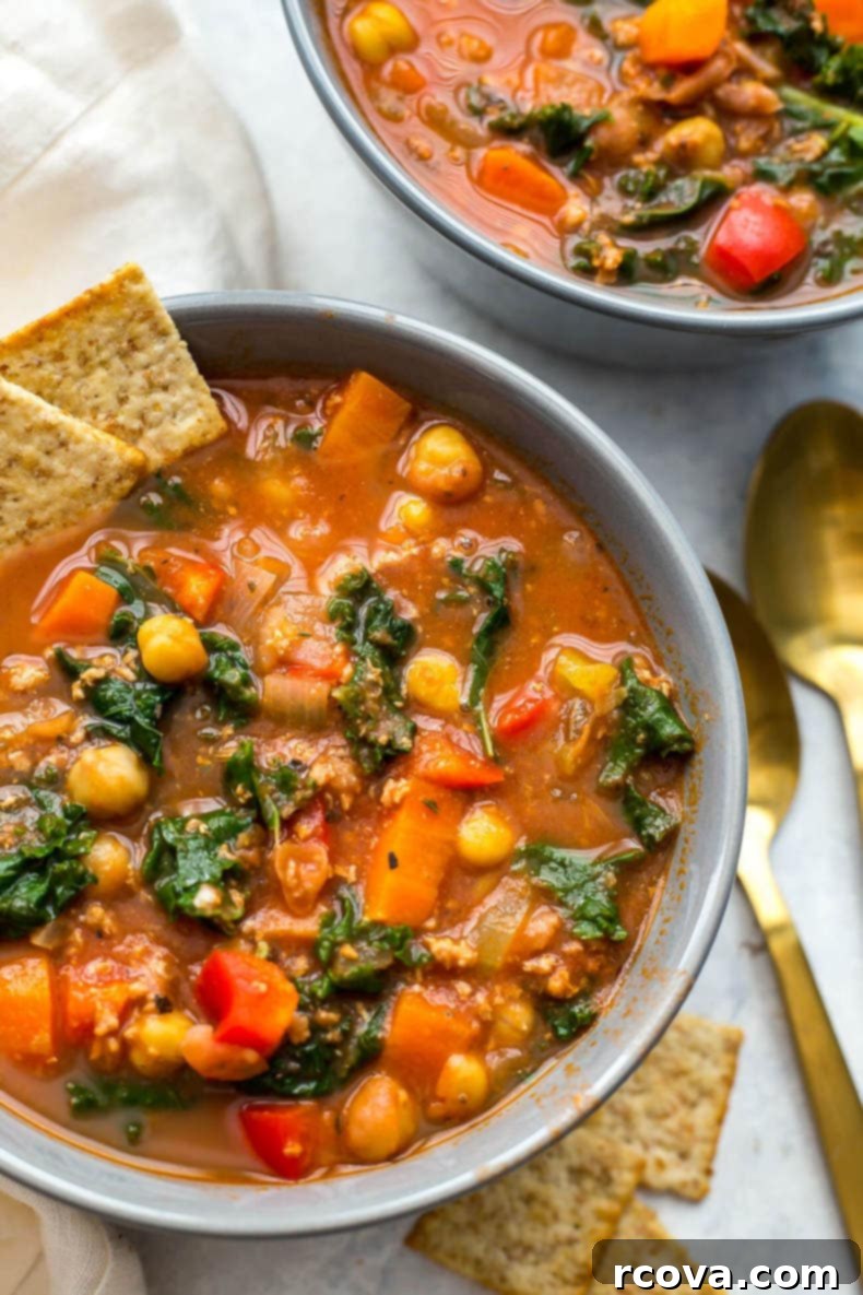 40+ Easy and Healthy Meal Prep Lunches for Work 10 Slow Cooker Tuscan Sausage and Kale Soup, a hearty veggie-filled dish.