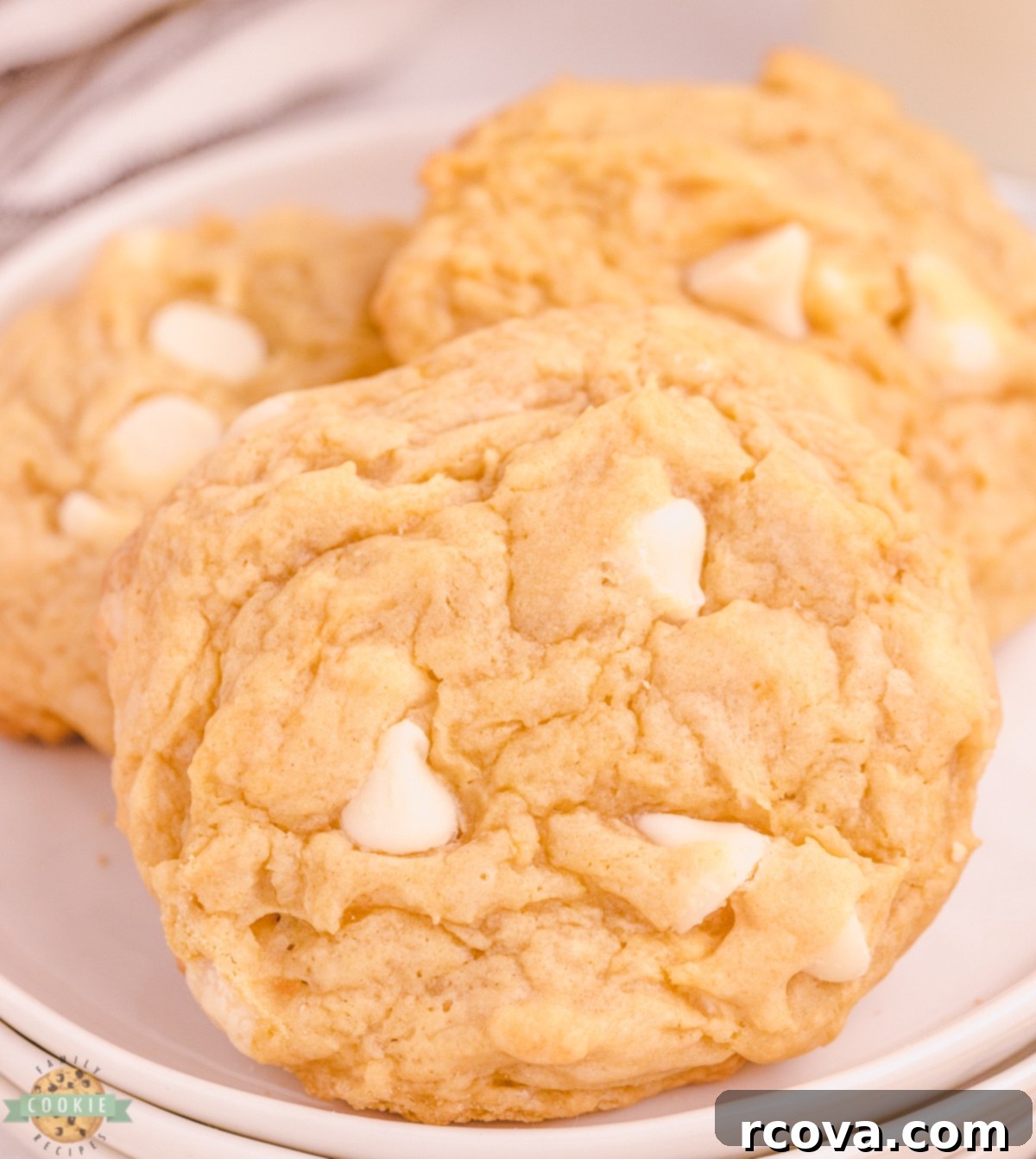 Velvet Banana Pudding Cookies 5 Close-up of banana pudding cookies loaded with white chocolate chips