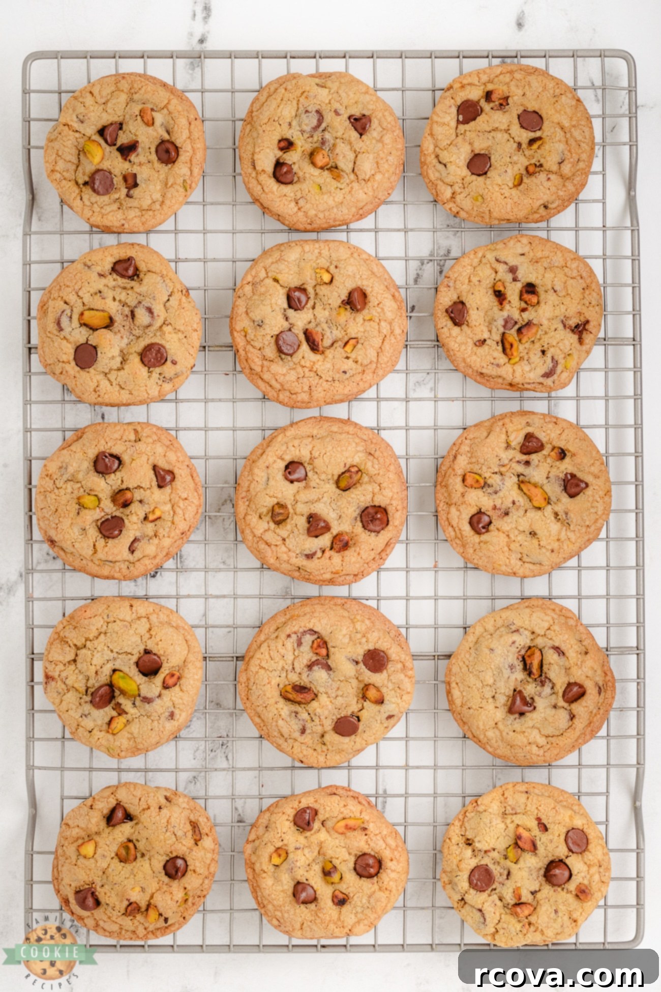 Toasted Pistachio & Decadent Chocolate Chip Bites 5 toasted pistachio cookies on a cooling rack