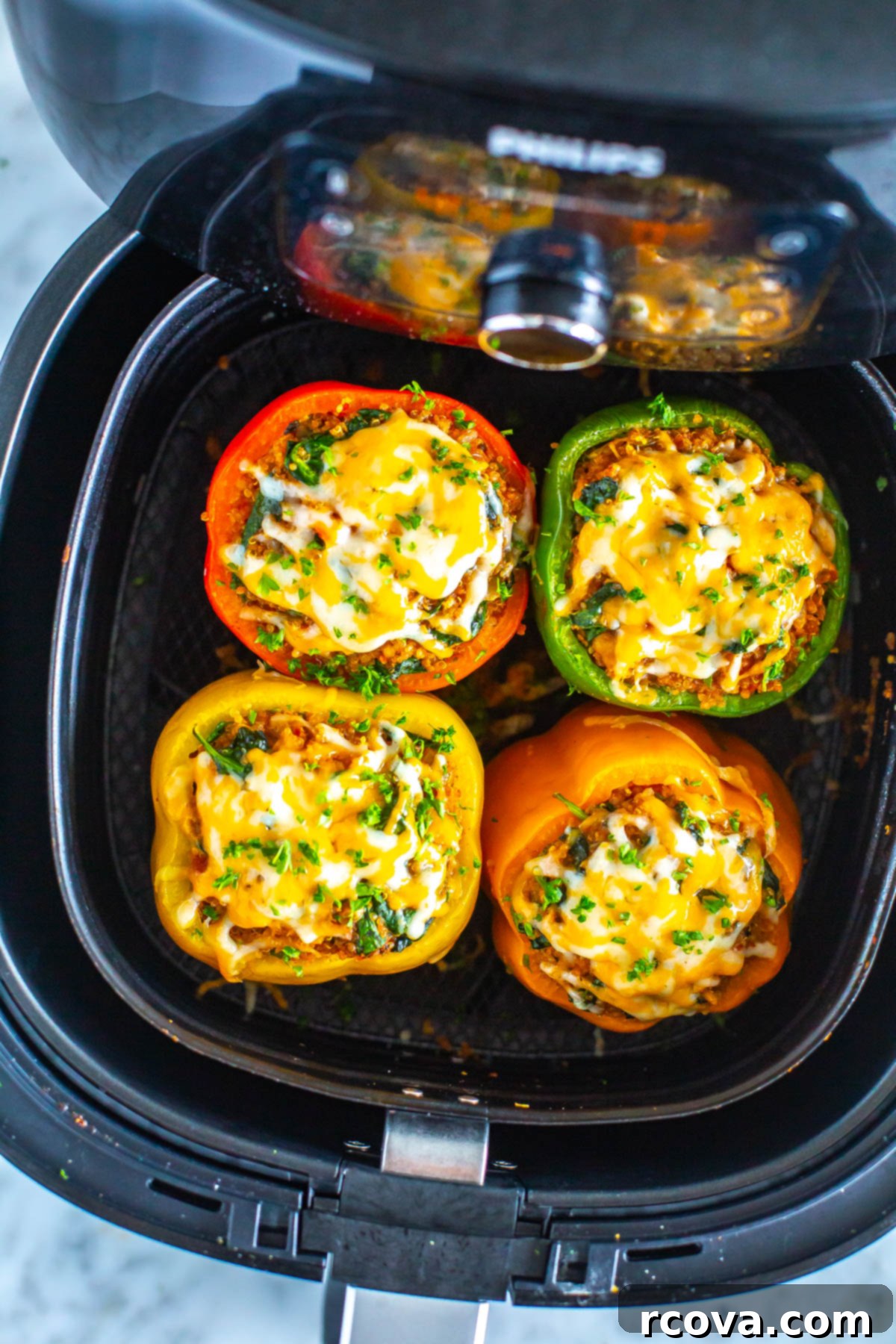 28 Deliciously Healthy Ground Turkey Meals 16 Four cooked air fryer stuffed peppers in an air fryer.