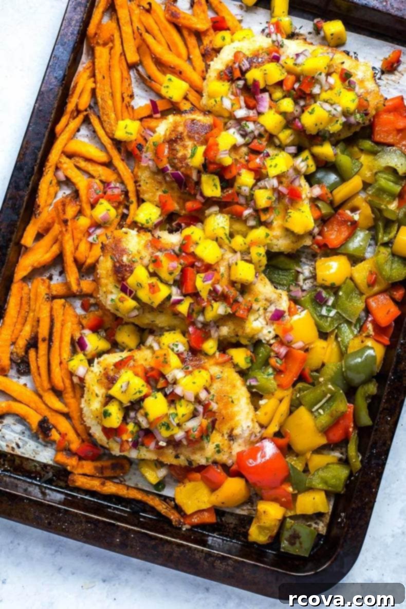 Sheet Pan Magic: Effortless Dinner Ideas 21 Sheet Pan Crispy Coconut Chicken with a side of mango salsa and sweet potato fries