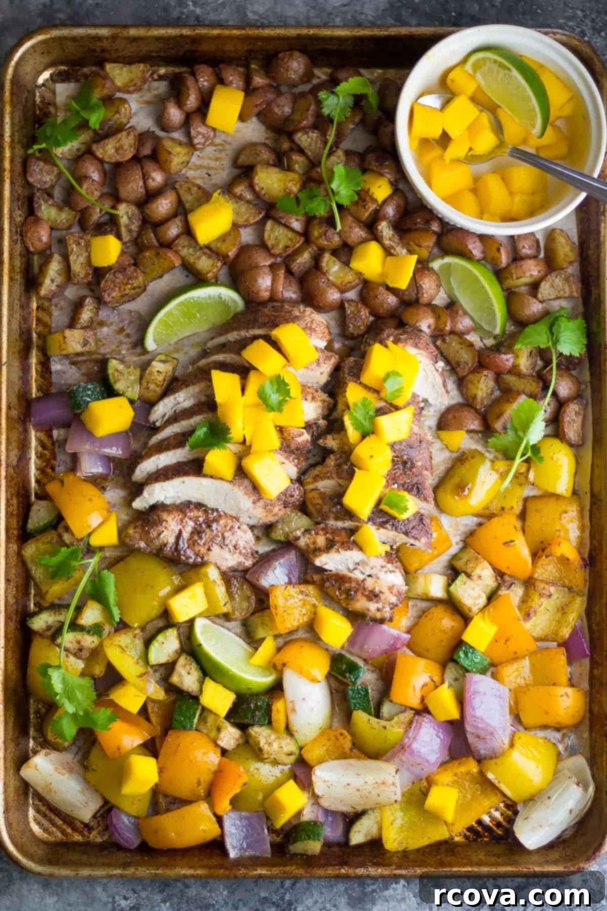 Sheet Pan Magic: Effortless Dinner Ideas 28 Jamaican Chicken Sheet Pan Dinner with bell peppers, onions, and potatoes