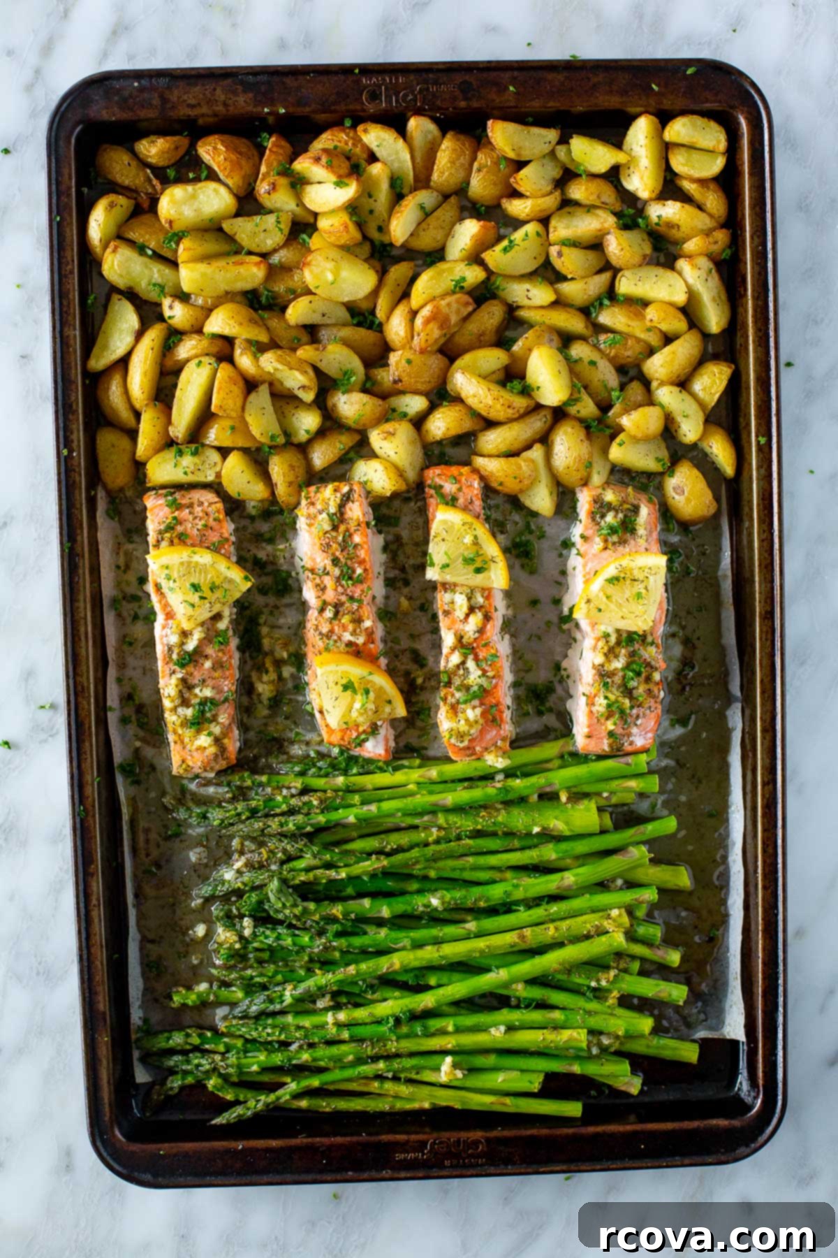 Sheet Pan Magic: Effortless Dinner Ideas 10 A sheet pan with perfectly roasted salmon fillets, potatoes, and asparagus, ready to serve.
