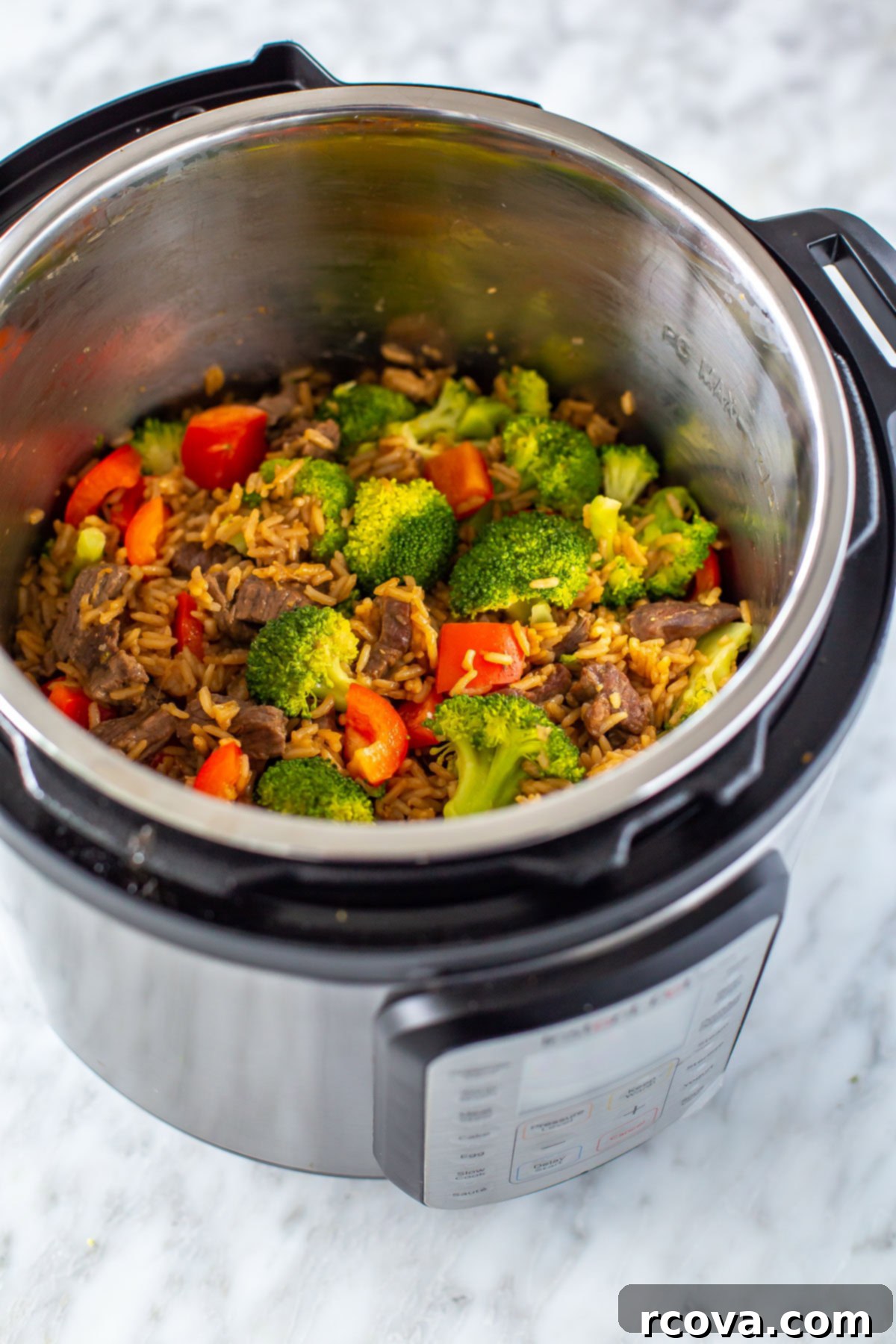 Quick Instant Pot Beef and Broccoli with Rice 8 An overhead shot of an Instant Pot with beef and broccoli inside.
