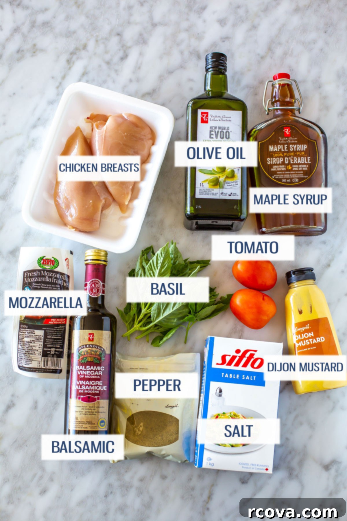 Caprese Hasselback Chicken Bake 4 Fresh ingredients laid out for Hasselback Caprese Chicken: boneless chicken breasts, ripe plum tomatoes, fresh mozzarella, fragrant basil leaves, olive oil, balsamic vinegar, maple syrup, Dijon mustard, salt, and pepper.