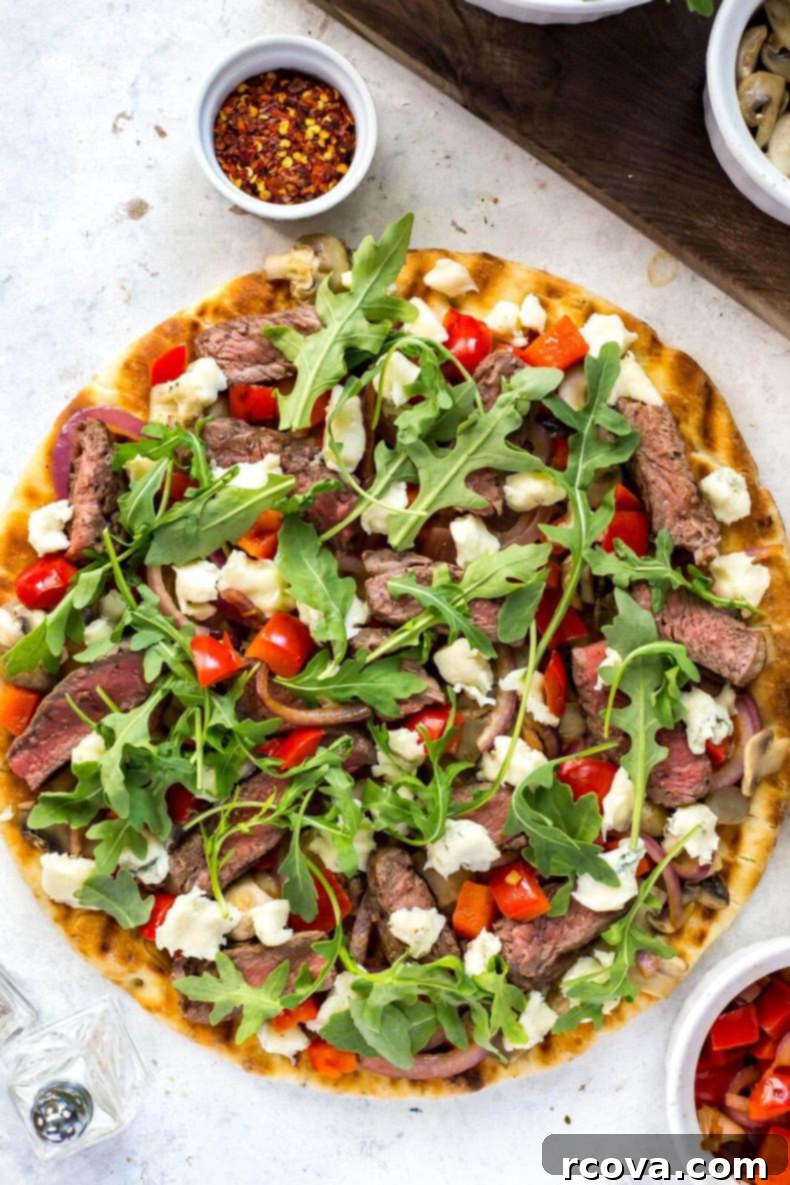 Gourmet Grilled Steak Gorgonzola Flatbread 7 Top-down view of Easy Steak Gorgonzola Flatbread cut into slices
