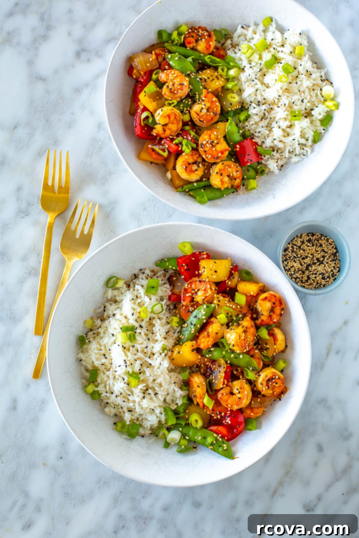 Quick & Wholesome Wok Wonders 21 Two bowls, each with a serving of honey garlic shrimp stir fry with a side of rice.