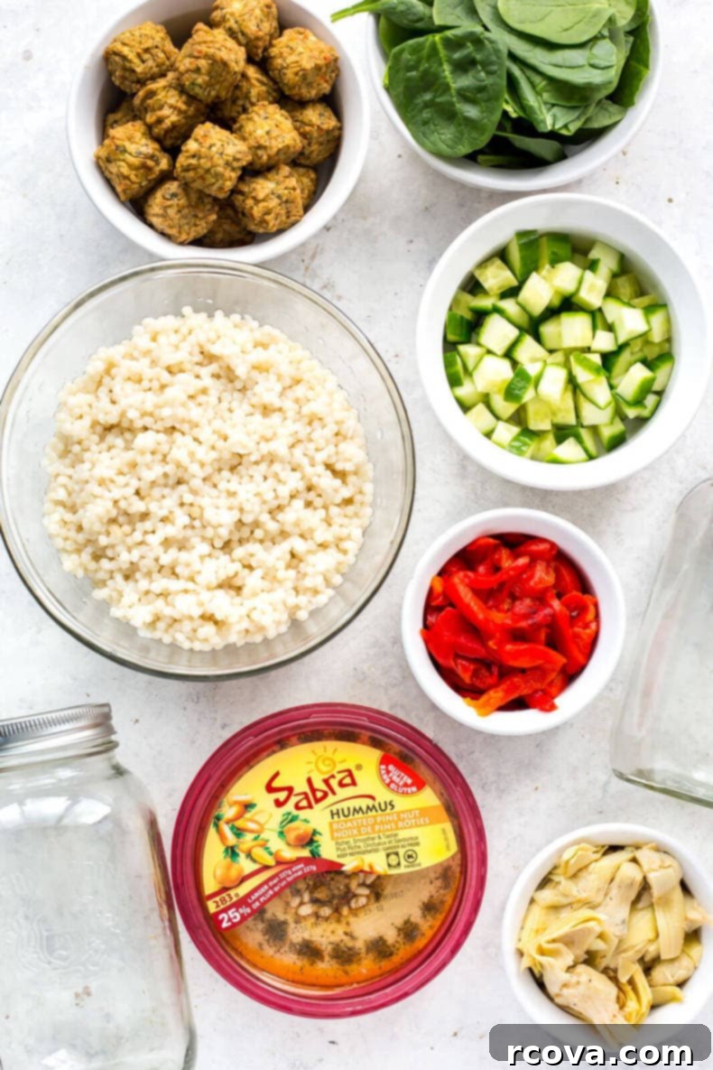 Ultimate Veggie Mason Jar Salad Two Ways 4 Two different vegetarian mason jar salads, ready for meal prep: one with BBQ flavors and another with Mediterranean ingredients.