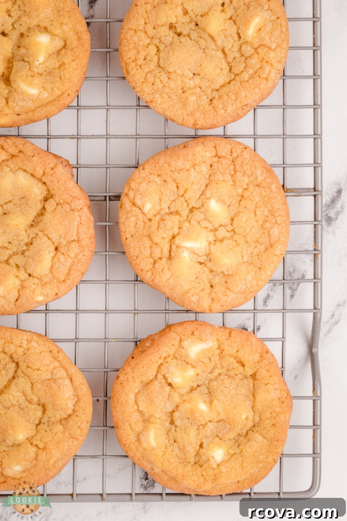 The Definitive Mrs. Fields White Chocolate Chip Cookie Recipe 6 mrs fields white chocolate chip cookies on a cooling rack