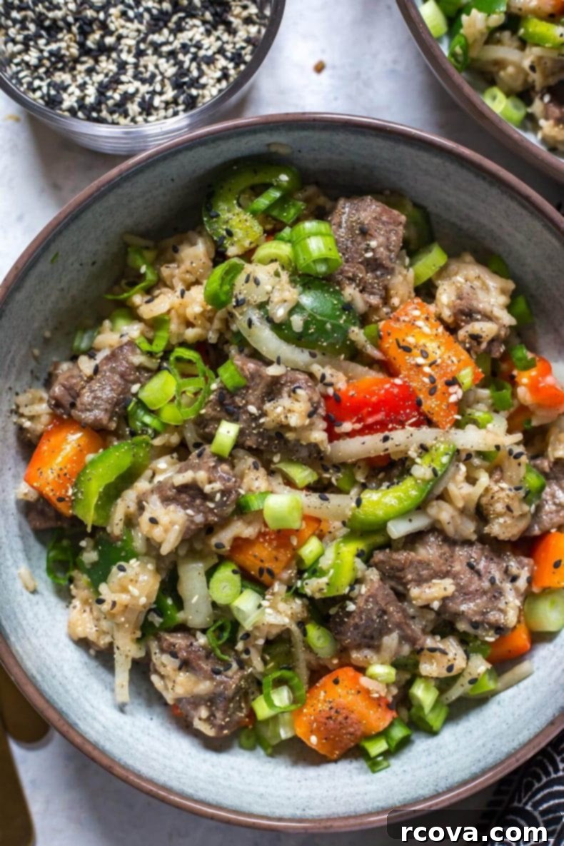 Quick and Tender Instant Pot Pepper Steak 5 Plated Instant Pot Pepper Steak, garnished with fresh green onions and sesame seeds, ready to be enjoyed