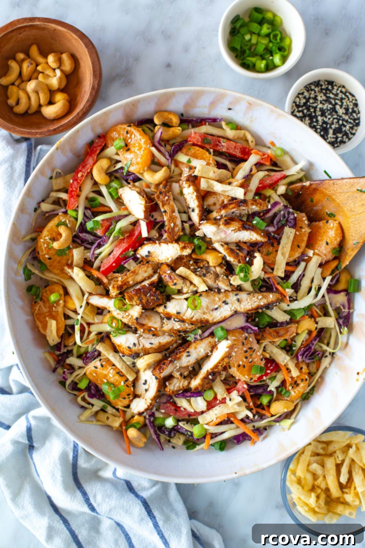 30+ Flavor-Packed Meal Prep Salads You'll Crave 14 A big bowl of Mandarin Chicken salad with toppings on it, bursting with fresh ingredients.