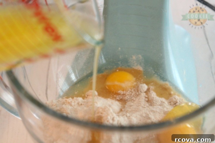 Easy Caramel Spice Cake Mix Cookies 4 Mixing spice cake mix and eggs for cookie dough