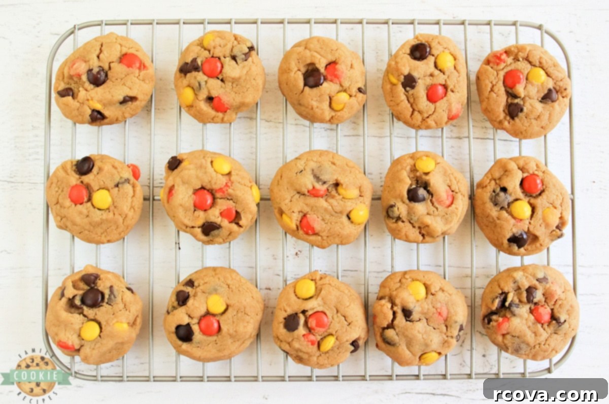Decadent Peanut Butter Cream Cheese Cookies 3 Reese's peanut butter cookies on a wire cooling rack.