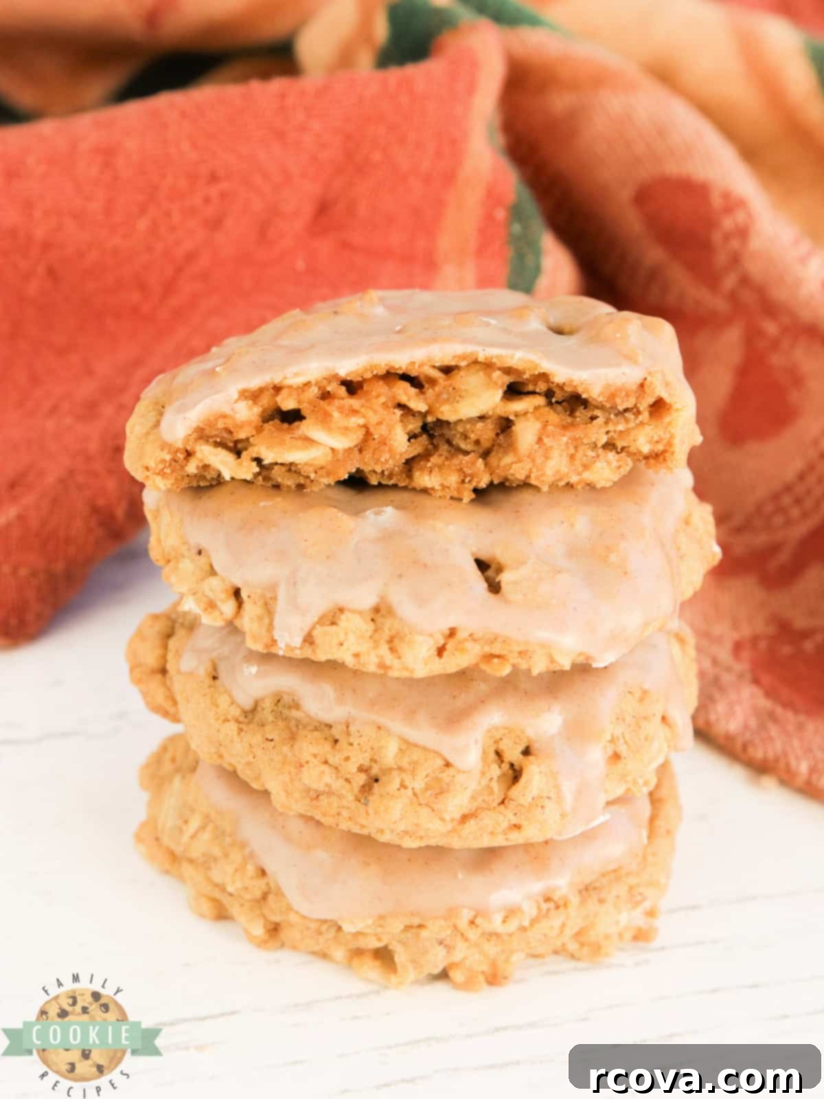 Sweet Glazed Pumpkin Oat Delights 3 A perfectly stacked pile of pumpkin oatmeal cookies, each generously coated with a glistening cinnamon sugar glaze.
