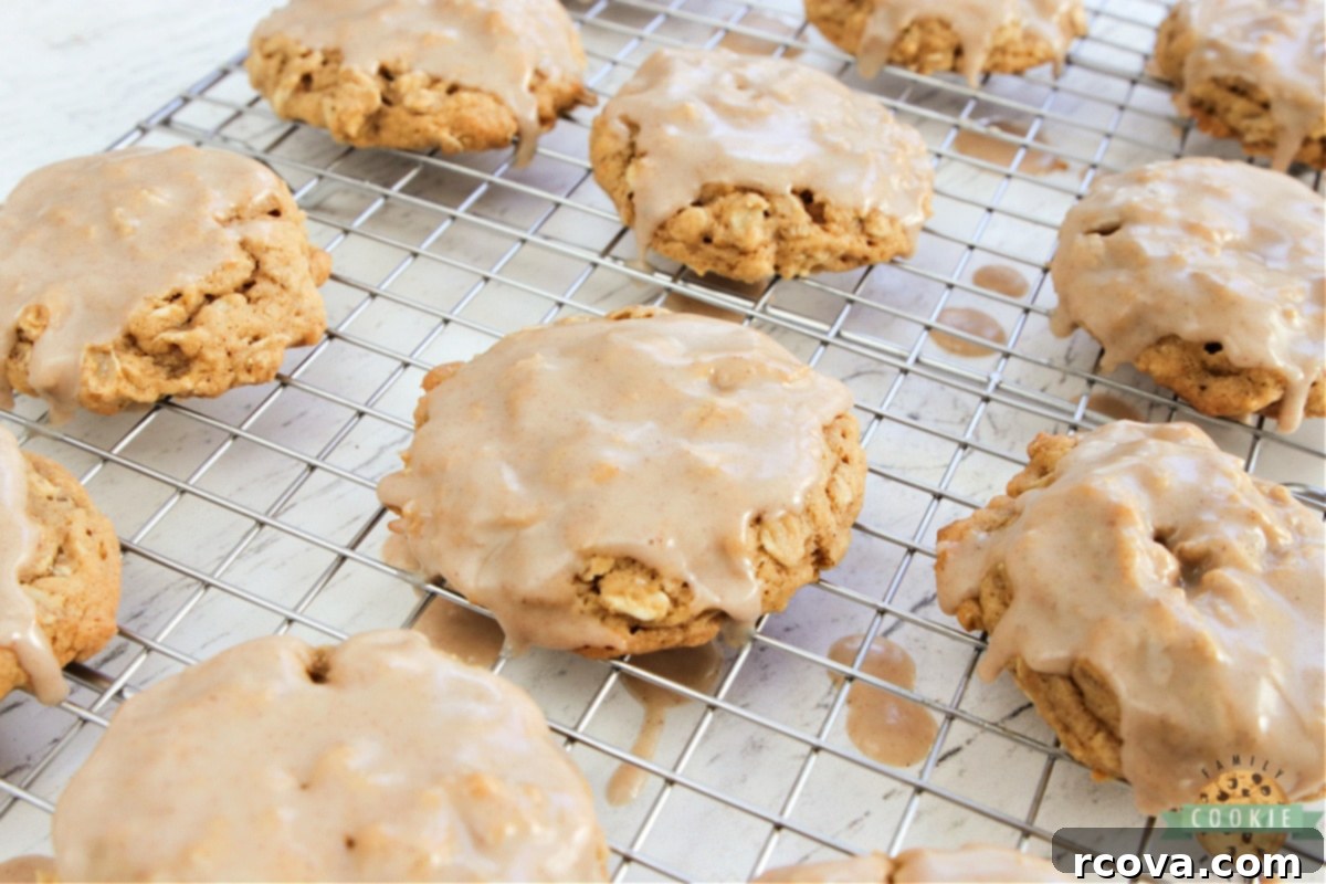 Sweet Glazed Pumpkin Oat Delights 6 Freshly glazed pumpkin oatmeal cookies drying on a wire rack, with the cinnamon sugar icing setting beautifully.
