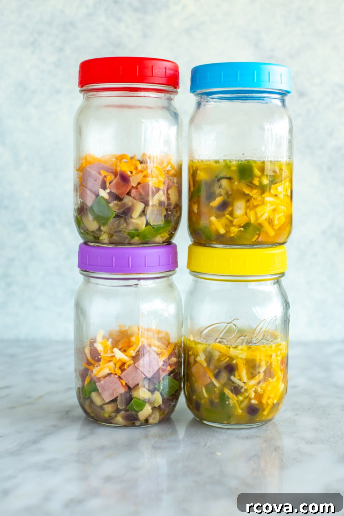 Fuel Your Mornings: Healthy Breakfast Prep 17 Four mason jars with microwave omelettes inside.