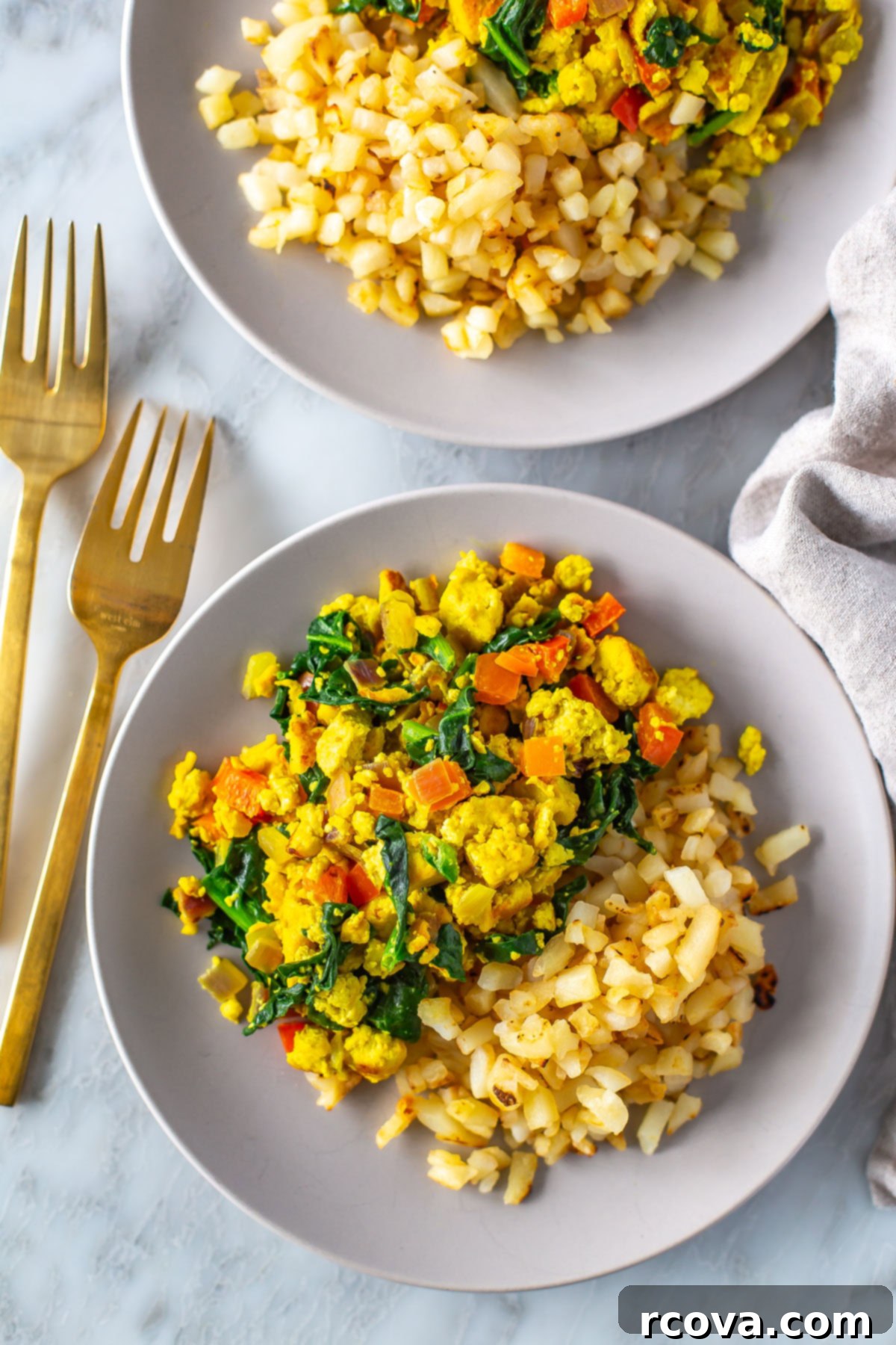 Fuel Your Mornings: Healthy Breakfast Prep 38 A plate of tofu scramble with a side of hashbrowns.