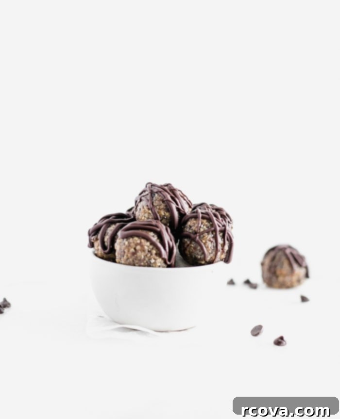 25+ Healthy Grab and Go Work Snacks 8 Quinoa Peanut Butter Cup Protein Balls via Lively Table, served in a small white bowl.