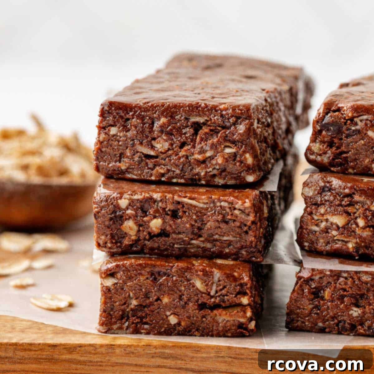 25+ Healthy Grab and Go Work Snacks 10 Chocolate Cashew Protein Bars via Build Your Bite, cut into squares.