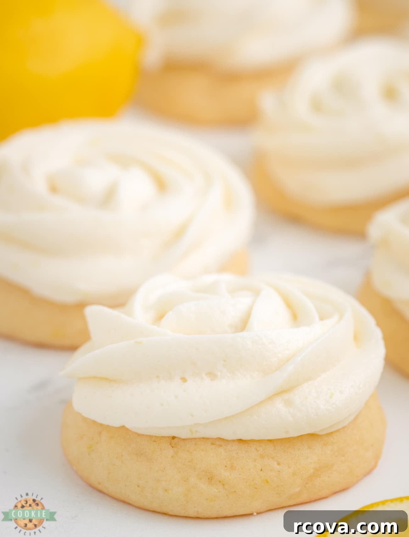 Sunshine Lemon Glazed Sugar Cookies 3 Lemon buttercream frosting piped in a beautiful rosette pattern on soft sugar cookies