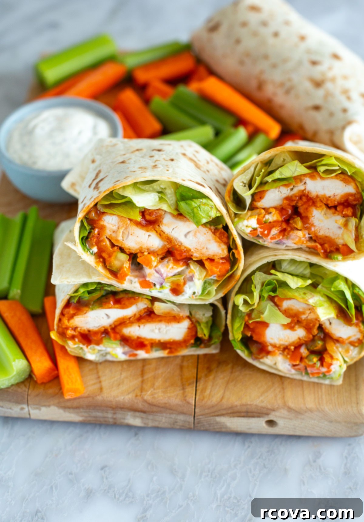 Ultimate Buffalo Chicken Wraps 8 Close-up shot of a crunchy buffalo chicken wrap, highlighting its delicious layers.