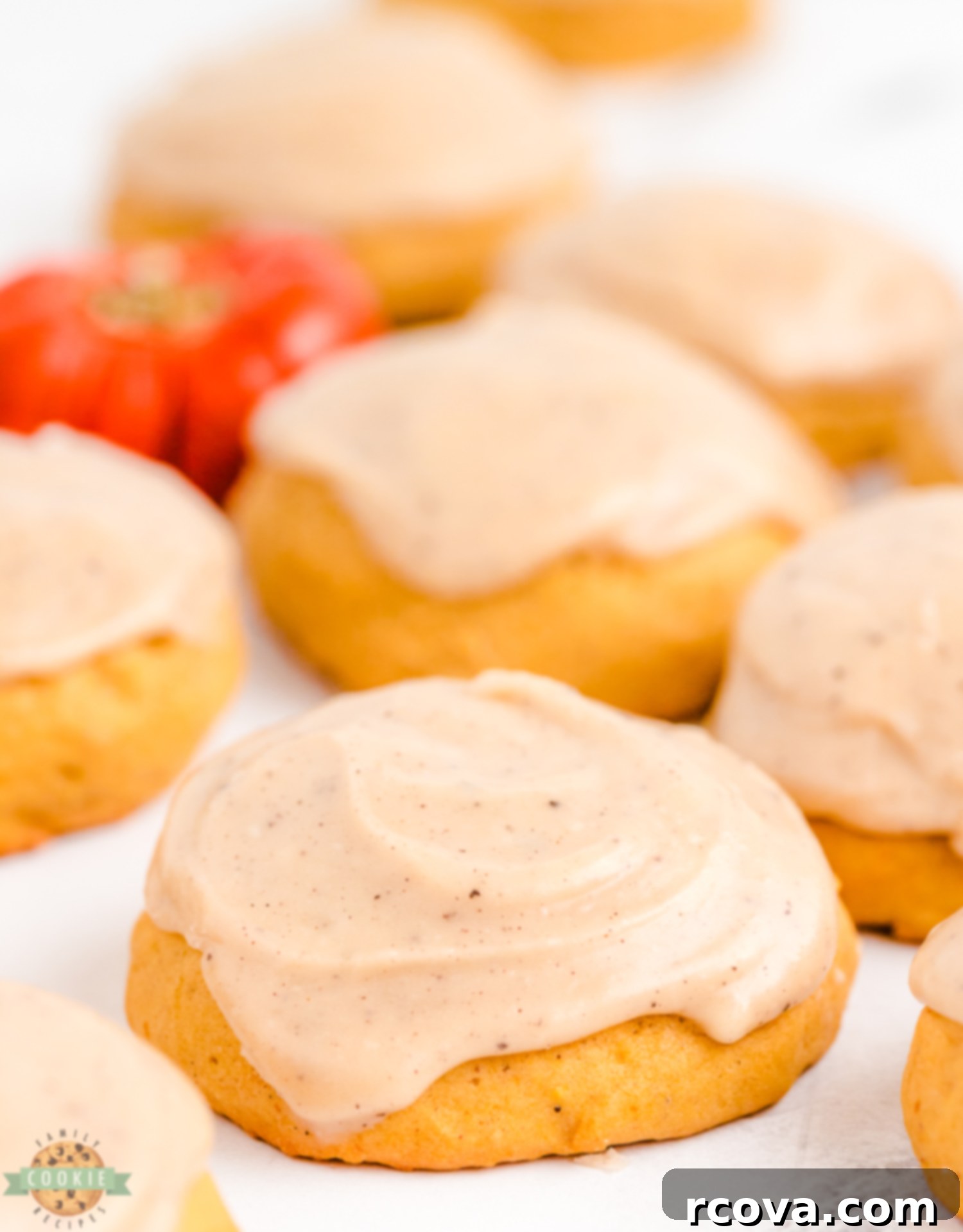 Spiced Frosted Pumpkin Ginger Cookies 10 A close-up of frosted pumpkin ginger cookies, emphasizing the perfect coverage and appealing texture of the brown butter frosting.